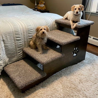 Image featuring two dogs sitting comfortably on the steps of our extra deep 23-inch pet steps in ebony stain with apollo blue carpeting, highlighting the product's size, color, and carpet option against a neutral background.