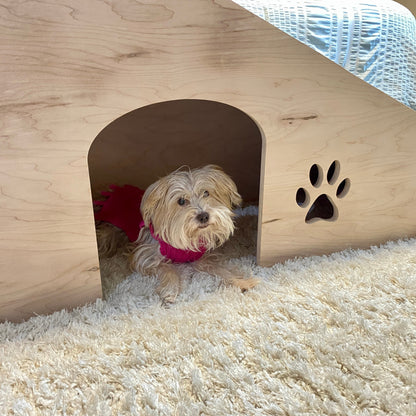 Image showing a dog happily laying inside the doggie door beneath our 20-inch pet ramp with platform, providing easy access and convenience for pets to move between spaces.